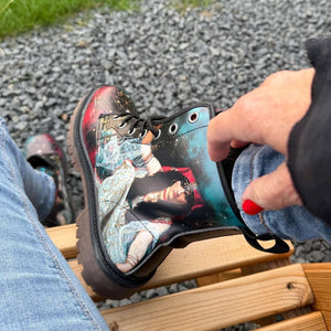 Wearing The Sorceress Triple Moon Goddess Unisex Combat Boots by Love Hype and Glory outside