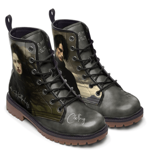 Pair of Bronte Wuthering Heights mismatched Cathy and Heathcliff boots on a white background